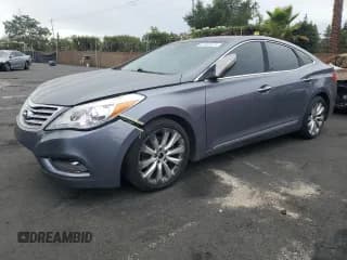 ✅ 2012 Hyundai Azera • VIN: KMHFH4JG6CA190810 • Лот: 81902675. Опубликован ранее на Copart с пробегом 204 579 миль. Бесплатный доступ к архиву аукционных продаж из США и подробный отчёт об истории автомобиля на DreamBid. Изображение 1.