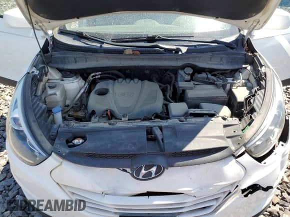 2015 Hyundai Tucson SE with VIN KM8JUCAG9FU102660, listed as a Copart auction lot 57199094 with 143,383 mi miles and Salvage title. Bid and sale history available at DreamBid. Image 12.