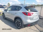 ✅ 2016 Mazda CX-5 Grand Touring • VIN: JM3KE4DY0G0856658 • Lot: 43778076. Wystawiony na IAAI z przebiegiem 103 388 mil. Bezpłatny archiwum sprzedaży aukcyjnych z USA i szczegółowy raport historii pojazdu na DreamBid. Zdjęcie 3.