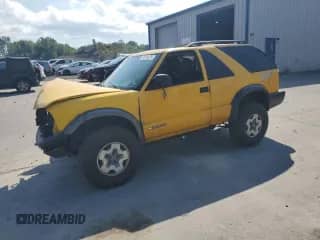 2004 Chevrolet Blazer LS z VIN 1GNCT18X44K153316, wystawiony jako Copart lot #61374025 z przebiegiem Nie podano mil oraz Szkoda całkowita • Salvage title. Historia ofert i sprzedaży dostępna na DreamBid. Obrazek 1.