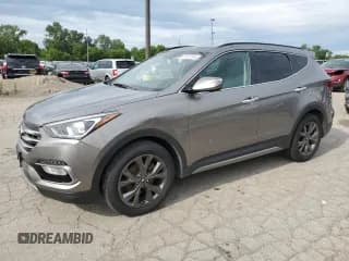 ✅ 2017 Hyundai Santa Fe Ultimate • VIN: 5XYZWDLA2HG492375 • Лот: 61767144. Опубликован ранее на Copart с пробегом 145 996 миль. Бесплатный доступ к архиву аукционных продаж из США и подробный отчёт об истории автомобиля на DreamBid. Изображение 1.