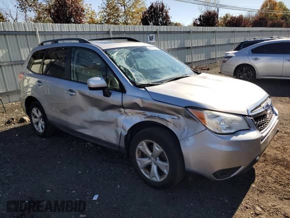 2015 Subaru Forester Premium with VIN JF2SJADC9FH477313, listed as a Copart auction lot 90075575 with 56,073 mi miles and Salvage title. Bid and sale history available at DreamBid. Image 4.