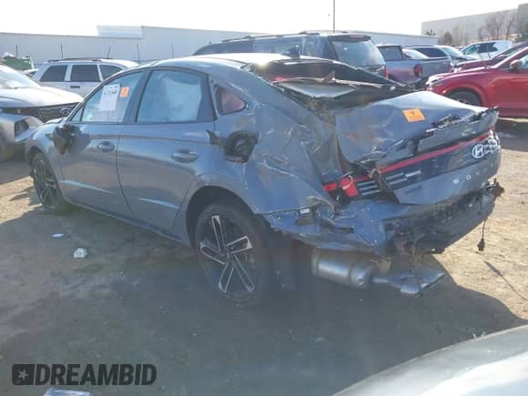 2024 Hyundai Sonata N Line with VIN KMHL54JC2RA352420, listed as a IAAI auction lot 41331640 with 9,128 mi miles and . Bid and sale history available at DreamBid. Image 3.