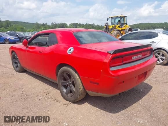 2014 Dodge Challenger SXT 100th Anniversary with VIN 2C3CDYAG0EH285477, listed as a IAAI auction lot 42298675 with 128,684 mi miles and . Bid and sale history available at DreamBid. Image 3.