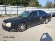 ✅ 2003 Cadillac DeVille • VIN: 1G6KD54Y43U218176 • Lot: 83851875. Listed on Copart with 130,690 mi. Free auction sales archive from the USA and detailed vehicle history report at DreamBid. Image 1.