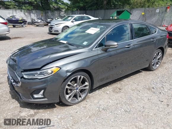 ✅ 2020 Ford Fusion Titanium • VIN: 3FA6P0D97LR116854 • Lot: 43081513. Listed on IAAI with 97,625 mi. Free auction sales archive from the USA and detailed vehicle history report at DreamBid. Image 2.