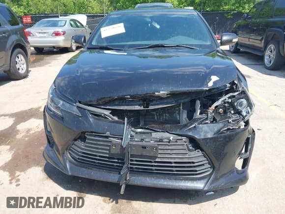 ✅ 2014 Scion tC • VIN: JTKJF5C77E3074541 • Лот: 42220698. Опубликован ранее на IAAI с пробегом 128 869 миль. Бесплатный доступ к архиву аукционных продаж из США и подробный отчёт об истории автомобиля на DreamBid. Изображение 6.