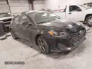 2019 Hyundai Veloster Premium z VIN KMHTG6AF6KU012014, wystawiony jako IAAI lot #41326232 z przebiegiem 101 413 mil mil oraz . Historia ofert i sprzedaży dostępna na DreamBid. Obrazek 1.