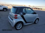 ✅ 2015 Smart fortwo Passion • VIN: WMEEJ9AA5FK829000 • Лот: 88367555. Опубликован ранее на Copart с пробегом Не указан. Бесплатный доступ к архиву аукционных продаж из США и подробный отчёт об истории автомобиля на DreamBid. Изображение 3.