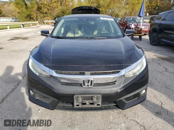 ✅ 2016 Honda Civic Touring • VIN: 19XFC1F99GE003364 • Lot: 90372945. Listed on Copart with 132,229 mi. Free auction sales archive from the USA and detailed vehicle history report at DreamBid. Image 5.