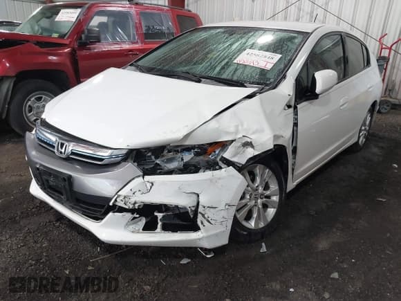 ✅ 2012 Honda Insight EX • VIN: JHMZE2H71CS003132 • Lot: 42582548. Listed on IAAI with 112,593 mi. Free auction sales archive from the USA and detailed vehicle history report at DreamBid. Image 2.