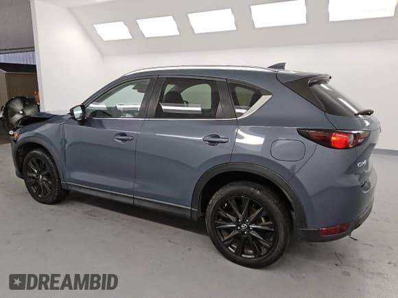 ✅ 2021 Mazda CX-5 Carbon Edition • VIN: JM3KFACY6M0410510 • Lot: 58585435. Listed on Copart with 56,319 mi. Free auction sales archive from the USA and detailed vehicle history report at DreamBid. Image 2.