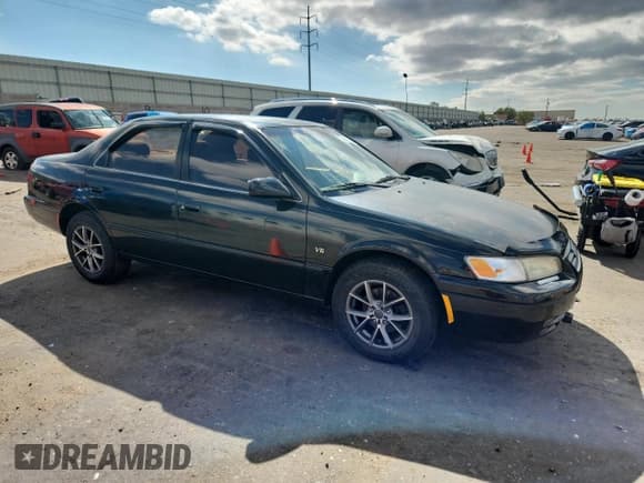 ✅ 1998 Toyota Camry LE • VIN: JT2BF22K9W0125551 • Lot: 86504565. Listed on Copart with 202,097 mi. Free auction sales archive from the USA and detailed vehicle history report at DreamBid. Image 4.