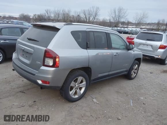 ✅ 2014 Jeep Compass Latitude • VIN: 1C4NJDEB5ED735075 • Lot: 43727060. Listed on IAAI with 167,279 mi. Free auction sales archive from the USA and detailed vehicle history report at DreamBid. Image 4.