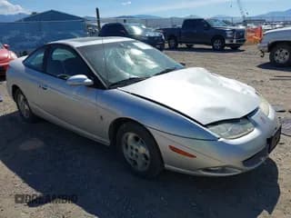 ✅ 2002 Saturn SC • VIN: 1G8ZY12722Z243236 • Лот: 42464967. Опубликован ранее на IAAI с пробегом 148 855 миль. Бесплатный доступ к архиву аукционных продаж из США и подробный отчёт об истории автомобиля на DreamBid. Изображение 1.