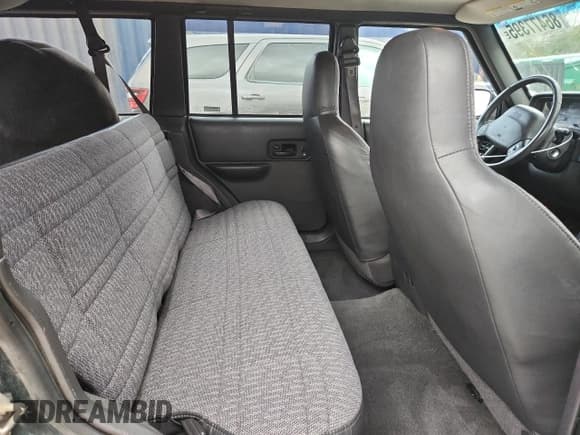 ✅ 2000 Jeep Cherokee • VIN: 1J4FF48S4YL113217 • Lot: 86477395. Listed on Copart with 153,937 mi. Free auction sales archive from the USA and detailed vehicle history report at DreamBid. Image 11.