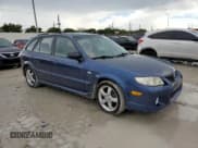 ✅ 2003 Mazda Protege • VIN: JM1BJ245931128629 • Lot: 81700205. Listed on Copart with 107,189 mi. Free auction sales archive from the USA and detailed vehicle history report at DreamBid. Image 4.