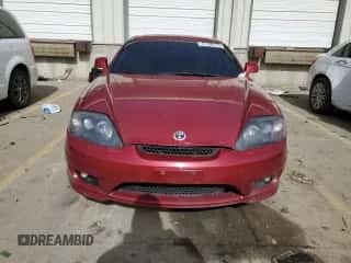 2006 Hyundai Tiburon GT z VIN KMHHN65F86U190230, wystawiony jako Copart lot #47736175 z przebiegiem 156 991 mil mil oraz Nie do naprawy • Non repairable. Historia ofert i sprzedaży dostępna na DreamBid. Obrazek 5.