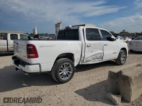 2023 Ram 1500 Laramie z VIN 1C6SRFJT9PN653506, wystawiony jako Copart lot #84952935 z przebiegiem 27 144 mil mil oraz Szkoda całkowita • Salvage title. Historia ofert i sprzedaży dostępna na DreamBid. Obrazek 3.