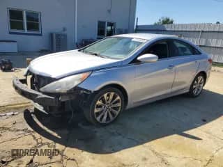 2013 Hyundai Sonata SE with VIN 5NPEC4AC7DH704752, listed as a Copart auction lot 71445235 with 174,055 mi miles and Salvage title. Bid and sale history available at DreamBid. Image 1.