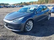 ✅ 2019 Tesla Model 3 Mid Range • VIN: 5YJ3E1EA3KF300884 • Lot: 43464125. Listed on IAAI with 80,989 mi. Free auction sales archive from the USA and detailed vehicle history report at DreamBid. Image 2.