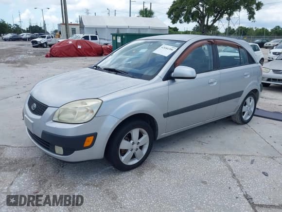 ✅ 2009 Kia Rio LX • VIN: KNADE243296494615 • Лот: 42684386. Опубликован ранее на IAAI с пробегом 162 379 миль. Бесплатный доступ к архиву аукционных продаж из США и подробный отчёт об истории автомобиля на DreamBid. Изображение 2.