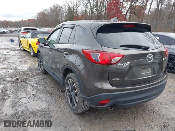 ✅ 2016 Mazda CX-5 Grand Touring • VIN: JM3KE4DY6G0738999 • Лот: 43670069. Опубликован ранее на IAAI с пробегом 168 251 миль. Бесплатный доступ к архиву аукционных продаж из США и подробный отчёт об истории автомобиля на DreamBid. Изображение 3.