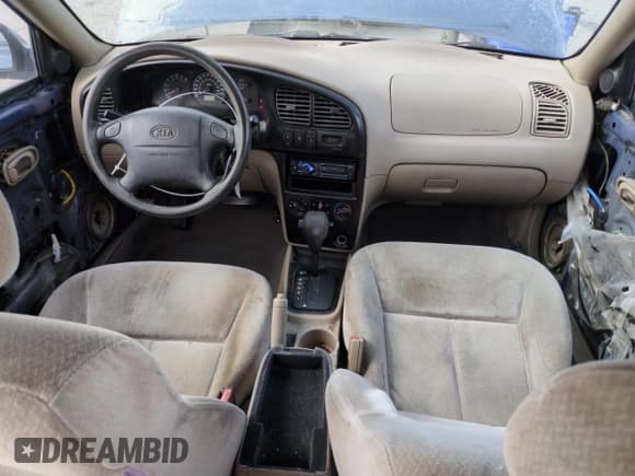 ✅ 2002 Kia Spectra • VIN: KNAFB121025197433 • Lot: 51838015. Listed on Copart with 209,660 mi. Free auction sales archive from the USA and detailed vehicle history report at DreamBid. Image 8.