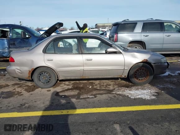 ✅ 2000 Toyota Corolla VE • VIN: 2T1BR12E4YC364551 • Лот: 43865745. Опубликован ранее на IAAI с пробегом 192 249 миль. Бесплатный доступ к архиву аукционных продаж из США и подробный отчёт об истории автомобиля на DreamBid. Изображение 13.