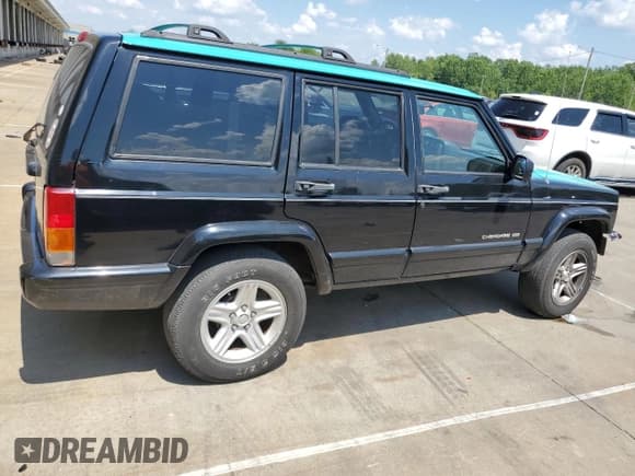 ✅ 2001 Jeep Cherokee Limited • VIN: 1J4FT58S81L569077 • Lot: 66385725. Listed on Copart with 103,319 mi. Free auction sales archive from the USA and detailed vehicle history report at DreamBid. Image 3.