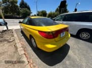 ✅ 2001 Saturn SC • VIN: 1G8ZY12771Z105142 • Лот: 67220545. Опубликован ранее на Copart с пробегом 166 396 миль. Бесплатный доступ к архиву аукционных продаж из США и подробный отчёт об истории автомобиля на DreamBid. Изображение 3.