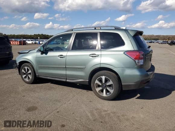 2017 Subaru Forester Limited with VIN JF2SJARC0HH523882, listed as a Copart auction lot 82651095 with 65,088 mi miles and Salvage title. Bid and sale history available at DreamBid. Image 2.
