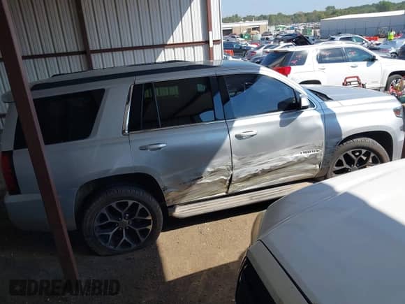 2015 Chevrolet Tahoe LT with VIN 1GNSCBKC2FR500868, listed as a IAAI auction lot 43368598 with 212,885 mi miles and . Bid and sale history available at DreamBid. Image 14.