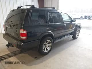 ✅ 2004 Nissan Pathfinder LE Platinum • VIN: JN8DR09Y94W902380 • Lot: 43694023. Listed on IAAI with 242,507 mi. Free auction sales archive from the USA and detailed vehicle history report at DreamBid. Image 4.