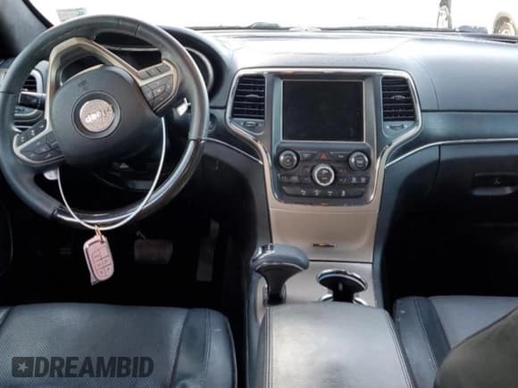 ✅ 2015 Jeep Grand Cherokee Summit • VIN: 1C4RJEJG0FC118974 • Lot: 49002165. Listed on Copart with 112,463 mi. Free auction sales archive from the USA and detailed vehicle history report at DreamBid. Image 8.