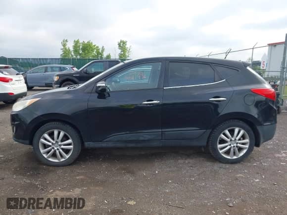 2010 Hyundai Tucson GLS with VIN KM8JUCAC0AU071627, listed as a IAAI auction lot 42617436 with 145,889 mi miles and . Bid and sale history available at DreamBid. Image 14.