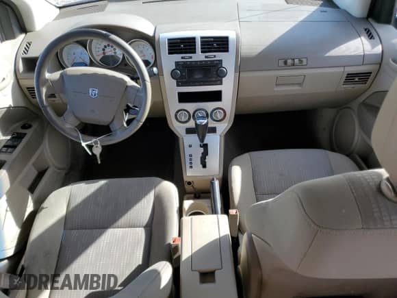 2007 Dodge Caliber SXT z VIN 1B3HB48BX7D587757, wystawiony jako Copart lot #77037124 z przebiegiem 168 505 mil mil oraz Szkoda całkowita • Salvage title. Historia ofert i sprzedaży dostępna na DreamBid. Obrazek 8.