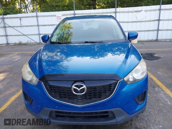 ✅ 2014 Mazda CX-5 Sport • VIN: JM3KE2BE7E0332563 • Lot: 42770891. Listed on IAAI with 145,924 mi. Free auction sales archive from the USA and detailed vehicle history report at DreamBid. Image 13.