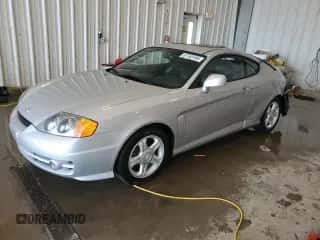 2003 Hyundai Tiburon GT с VIN KMHHN65F53U019155, выставлен на аукционе Copart как лот 67763185 с пробегом 66 114 миль миль и На запчасти • Non repairable. История ставок и продаж доступна на DreamBid. Изображение 1.