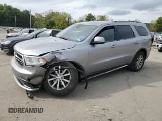 2016 Dodge Durango SXT с VIN 1C4RDJAG3GC385673, выставлен на аукционе Copart как лот 82114895 с пробегом 157 773 миль миль и Списание • Salvage title. История ставок и продаж доступна на DreamBid. Изображение 1.