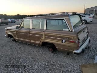 ✅ 1988 Jeep Grand Wagoneer • VIN: 1JCNJ15UXJT028696 • Lot: 74972374. Wystawiony na Copart z przebiegiem 186 789 mil. Bezpłatny archiwum sprzedaży aukcyjnych z USA i szczegółowy raport historii pojazdu na DreamBid. Zdjęcie 2.