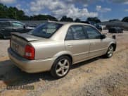 ✅ 2003 Mazda Protege DX • VIN: JM1BJ225531134351 • Lot: 84469285. Wystawiony na Copart z przebiegiem 148 353 mil. Bezpłatny archiwum sprzedaży aukcyjnych z USA i szczegółowy raport historii pojazdu na DreamBid. Zdjęcie 3.