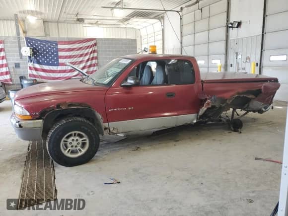 1999 Dodge Dakota SLT z VIN 1B7GG22X0XS197699, wystawiony jako Copart lot #61057935 z przebiegiem 147 833 mil mil oraz Szkoda całkowita • Salvage title. Historia ofert i sprzedaży dostępna na DreamBid. Obrazek 1.