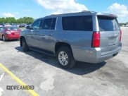 ✅ 2020 Chevrolet Suburban LT • VIN: 1GNSCHKC4LR302047 • Lot: 42518927. Listed on IAAI with 105,760 mi. Free auction sales archive from the USA and detailed vehicle history report at DreamBid. Image 3.