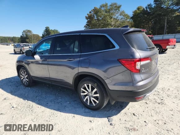 ✅ 2021 Honda Pilot EX-L • VIN: 5FNYF5H51MB028413 • Lot: 82764175. Listed on Copart with 52,831 mi. Free auction sales archive from the USA and detailed vehicle history report at DreamBid. Image 2.