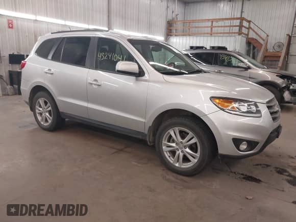 2012 Hyundai Santa Fe SE with VIN 5XYZHDAG5CG129742, listed as a IAAI auction lot 43241041 with 95,818 mi miles and . Bid and sale history available at DreamBid. Image 1.