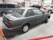 ✅ 1991 Nissan Sentra E • VIN: 1N4EB32A2MC701771 • Lot: 43669744. Listed on IAAI with 140,209 mi. Free auction sales archive from the USA and detailed vehicle history report at DreamBid. Image 4.