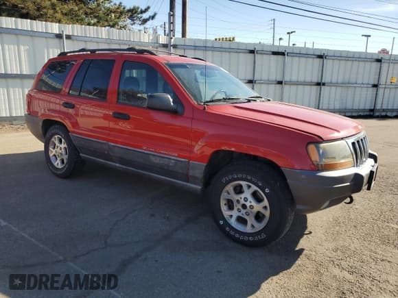 ✅ 2000 Jeep Grand Cherokee Laredo • VIN: 1J4GW48S1YC214915 • Lot: 82728995. Listed on Copart with 111,305 mi. Free auction sales archive from the USA and detailed vehicle history report at DreamBid. Image 4.
