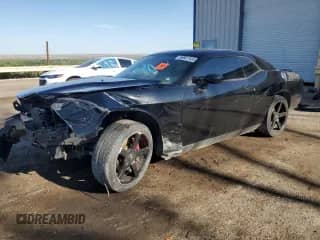 2012 Dodge Challenger SXT z VIN 2C3CDYAG3CH294428, wystawiony jako Copart lot #59977455 z przebiegiem 189 417 mil mil oraz Szkoda całkowita • Salvage title. Historia ofert i sprzedaży dostępna na DreamBid. Obrazek 1.