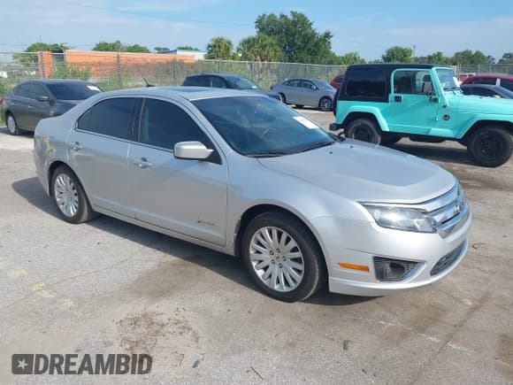 ✅ 2012 Ford Fusion Hybrid • VIN: 3FADP0L3XCR245014 • Лот: 43085398. Опубликован ранее на IAAI с пробегом 197 269 миль. Бесплатный доступ к архиву аукционных продаж из США и подробный отчёт об истории автомобиля на DreamBid. Изображение 1.